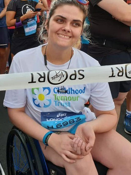 Nicole taking part in a run in her wheelchair