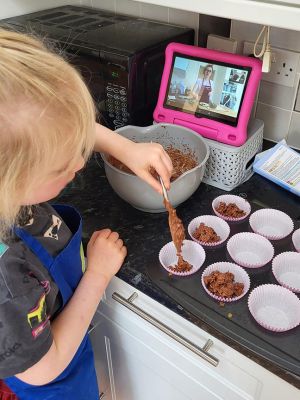 Young girl making cakes